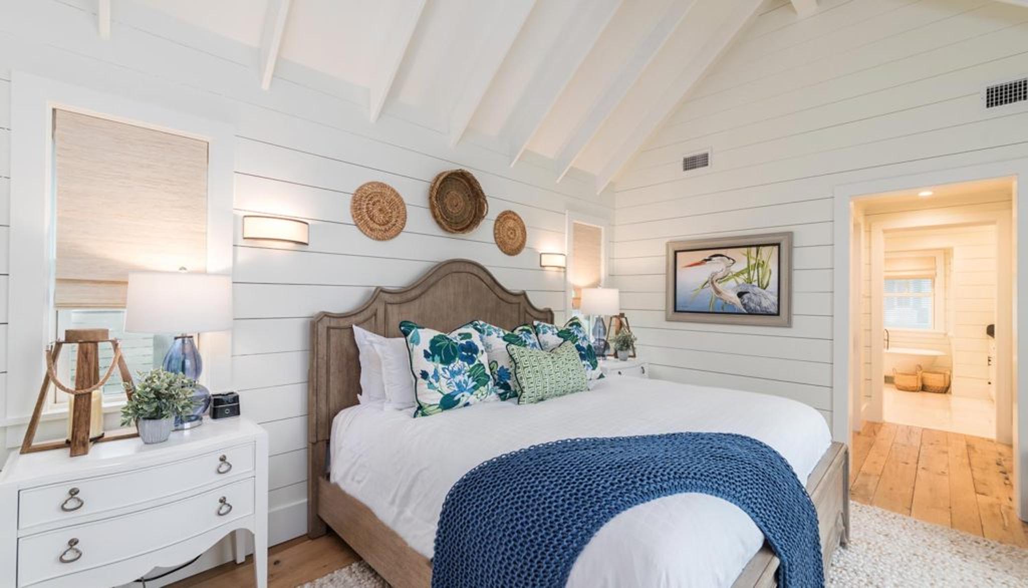 White painted bedroom with large bed